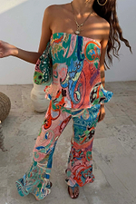 Blue Mari Plisse Trousers and matching bandeau top in a pastel paisley print, styled as a summer co-ord.