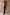 Thumbnail for Chocolate Sabine Dress, a brown maxi with a draped cowl halter neck and soft column silhouette against a stone wall.