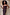 Thumbnail for Multi-wear Chocolate Sabine Dress in brown stretch fabric, styled strapless against a stone wall and designed in London.