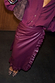 Burgundy vegan leather Ruffle Jaspre wrap skirt styled with a matching shirt and leopard print heels.