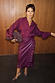 Burgundy Vegan Leather Ruffle Jaspre multi-wear skirt styled with a matching shirt and leopard print heels.
