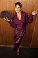 Thumbnail for Burgundy Vegan Leather Ruffle Jaspre wrap skirt styled with a matching shirt, leopard heels and a brown clutch bag.