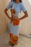 Ice Blue Floral Rib Dress featuring a bold orange floral print and soft stretch ribbed texture in a maxi silhouette.