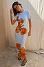 Ice Blue Floral Rib Dress with bold orange flower prints, a ribbed stretch fabric and maxi silhouette.