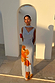 Ice Blue Floral Sophie Dress featuring a drape neckline, large orange floral print and a multi-wear neck scarf.