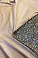 Silver Sequin Mini Jaspre Skirt showing the shimmering sequins and smooth satin lining.