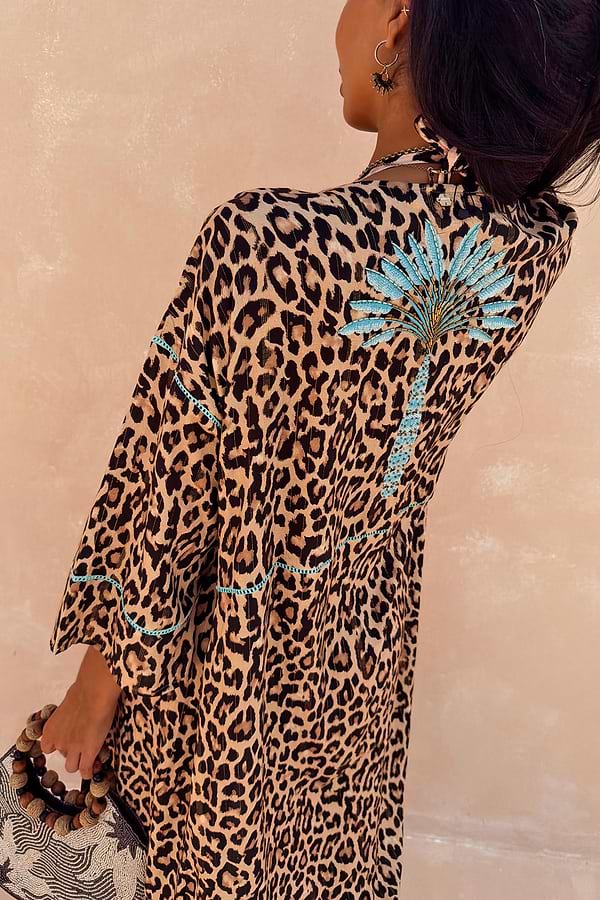 Leopard Kimono featuring a blue palm motif on the back and contrast whipstitch detailing on the sleeves.