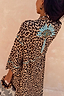 Leopard Kimono featuring a blue palm motif on the back and contrast whipstitch detailing on the sleeves.