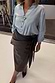 Thumbnail for Black vegan leather Jaspre wrap midi skirt with a tulip tie on a UK size 18 model, with a light blue shirt.