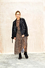 Leopard Lucia Sheer Dress in iconic leopard print, styled with a black leather jacket and combat boots.