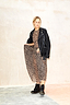 Leopard Lucia Sheer Dress in iconic leopard print, styled with a black leather biker jacket and boots.