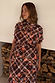Chocolate brown check floral top with a high neck and draped sleeves, worn with a matching co-ord skirt.