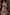 Thumbnail for Chocolate Check Floral Top featuring a high neck and floral motifs, styled with a draped brown blazer.