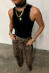 Black Ribbed Tank wardrobe staple styled with leopard print trousers and layered gold jewellery.