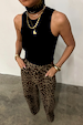 Black Ribbed Tank wardrobe staple styled with leopard print trousers and layered gold jewellery.