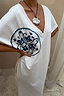 Cream cotton Dolce Vita T-Shirt Dress with a blue hand-painted Greek-inspired sun motif and deep V-neckline.