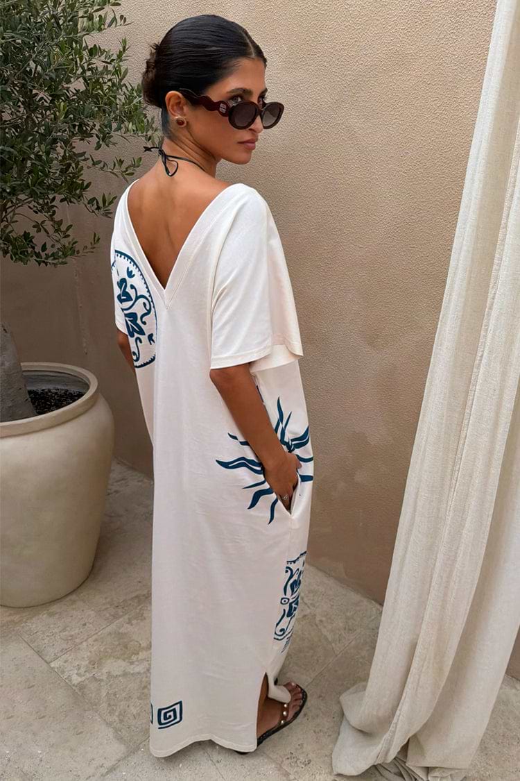 Cream cotton Dolce Vita T-Shirt Dress with blue Greek-inspired sun motifs, side pockets and a multi-wear V-back.