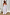 Thumbnail for Model wearing the White Island Cross Stitch Maxi Dress featuring a colourful tropical print and rope strap detailing.