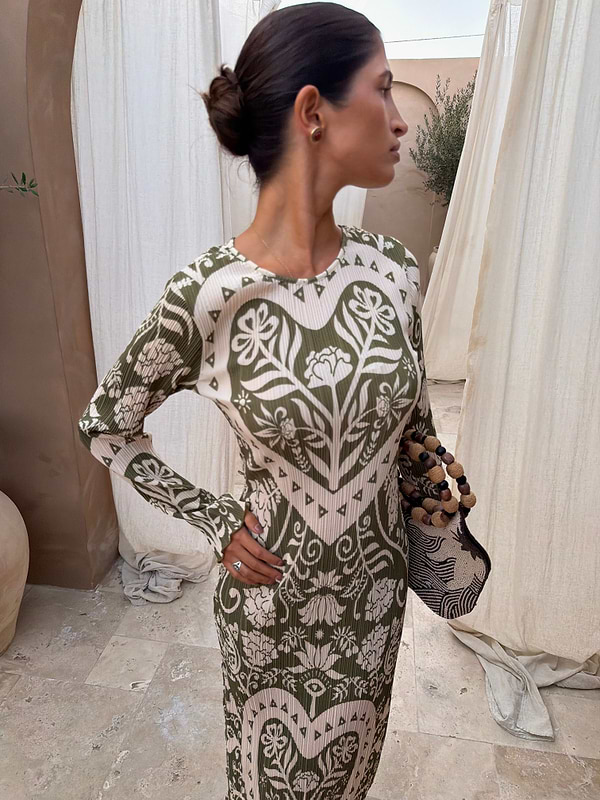 Olive Amara Plisse Gaia Dress featuring a green heart floral print and long sleeves in a textured plisse fabric.