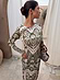 Olive Amara Plisse Gaia Dress featuring a green heart floral print and long sleeves in a textured plisse fabric.