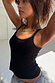 Thumbnail for Black Teddy Vest featuring mesh trim at the neckline and armholes, styled with a gold fish pendant.