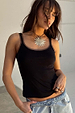 Black Teddy Vest featuring a sheer mesh trim at the neckline and straps, styled with light wash jeans.