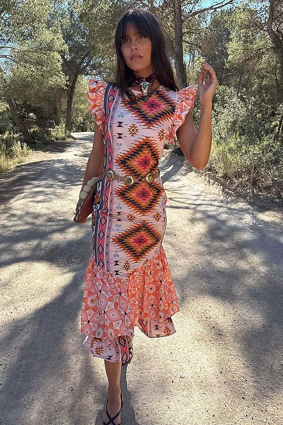 Bridget Print Frida Dress with a multicoloured geometric print, frilled sleeves and a tiered skirt hem.
