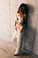 Silver Sequin Bra featuring triangle cups and thin straps, styled with matching sequin trousers against a wall.