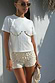 Thumbnail for Cream Shells Hot Pants with pearlescent shell beads and glass beading, styled for a summer vacation look.