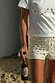 Thumbnail for Shells Hot Pants in cream with pearlescent shell beads, styled with a matching tee for a beach vacation.
