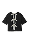 Black cotton t-shirt featuring three cream ribbon bows along the open back and dropped shoulders.