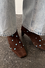 Chocolate Studded Suede Boots with turquoise studs and a square toe, styled with light wash denim jeans.