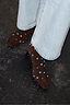 Chocolate Studded Suede Boots with turquoise studs and square toes, styled with light-wash denim.