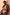 Thumbnail for Abstract Plunge Swimsuit in sunset tones with a painterly print and ruched waist on a curve model.