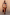 Thumbnail for Abstract Plunge Swimsuit in sunset tones with a painterly print, plunging neckline and ruched waist on a curve model.