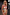 Thumbnail for Abstract Plunge Swimsuit in painterly sunset tones with a plunging neckline and ruched waist detailing.