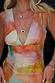 Abstract Plunge Swimsuit in sunset tones with a painterly print, plunge neckline and ruched waist detailing.