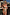 Thumbnail for Abstract Plunge Swimsuit featuring a sunset painterly print and ruched waist, styled for a sunny vacation look.