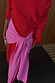Thumbnail for Red and Pink Afia Midi Dress in a soft knit, highlighting the contrast pink multi-wear wrap tie detail.