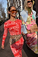 Red Bandana Alexa Cardigan in a paisley print, styled as a co-ord for a London street style look.