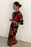 Slim fit Black Amara Hollie Cardigan with iconic hand-painted eye and heart motifs, styled with a matching maxi skirt.