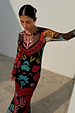 Black Amara Mesh Dress with vibrant hand-painted heart and eye motifs on a long-sleeved, stretchy mesh silhouette.