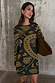 Olive Amara Knit Mini Dress featuring yellow icon motifs, styled with a large brown bag.