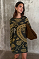 Olive Amara Knit Mini Dress featuring iconic motifs on a soft khaki knit base, paired with a suede bag.