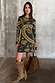 Olive Amara Knit Mini Dress with iconic hand, flower and eye motifs, styled with tall suede boots and a brown tote bag.