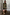 Thumbnail for Olive Amara Knit Mini Dress with iconic motifs, styled with tall tan boots and a large brown suede tote bag.