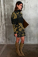 Olive Amara Knit Mini Dress with iconic gold motifs and statement fringe, worn by a 5ft7” model who wears size M.