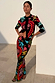 Black Amara Dorris Skirt with colourful hand-painted heart and eye motifs, styled with a matching cardigan.