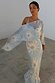 Blue Soleil Anais Dress featuring a sheer off-the-shoulder draped top and sun motif print on a bias-cut skirt.