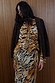 Tiger print Animal Cali Top featuring tie-front fastenings, styled with a matching skirt and dark brown jacket.